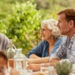 Photo of older people having lunch outdoors