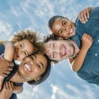 Multiracial family of four - wife, husband, son, daughter