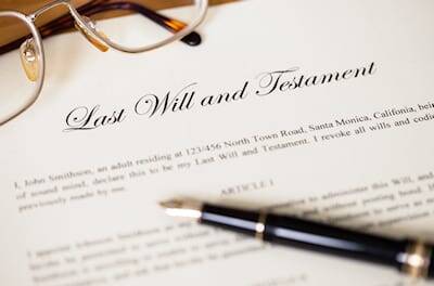 Photo of reading glasses and Last Will and Testament document