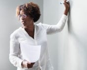 Photo of African-American teacher at a whiteboard