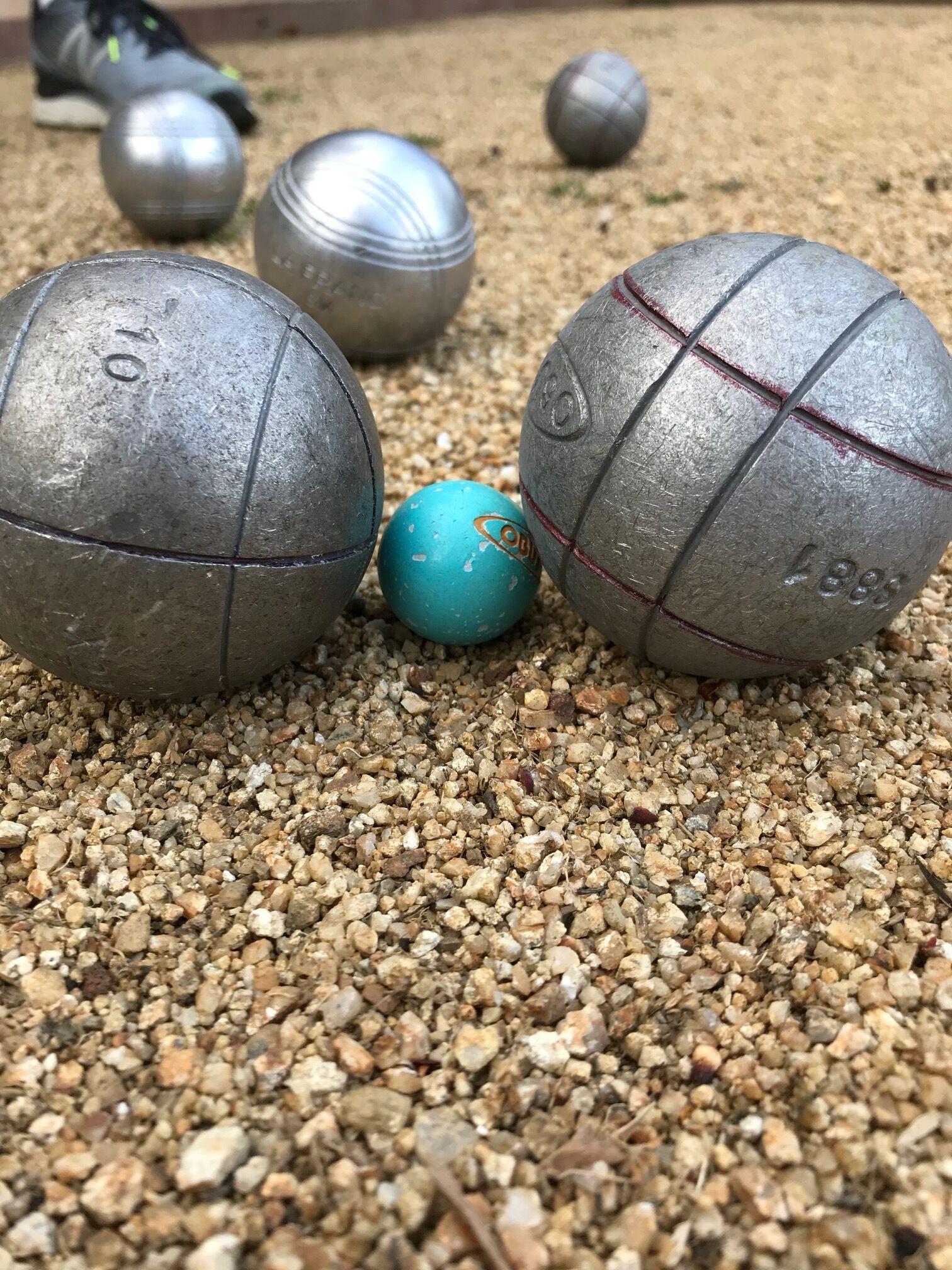 Closeup of boules in a game of petanque