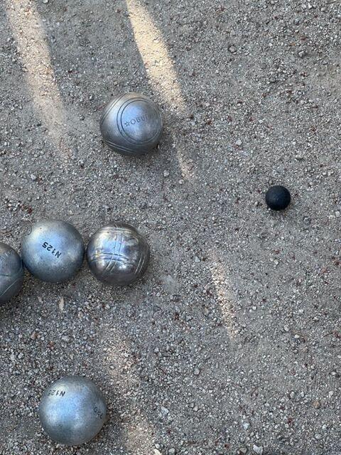 Closeup of boules in a game of petanque